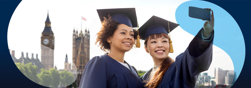 Female students graduating taking selfie