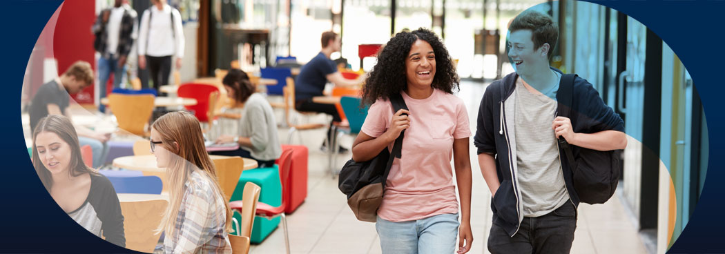 Male and female college students in library